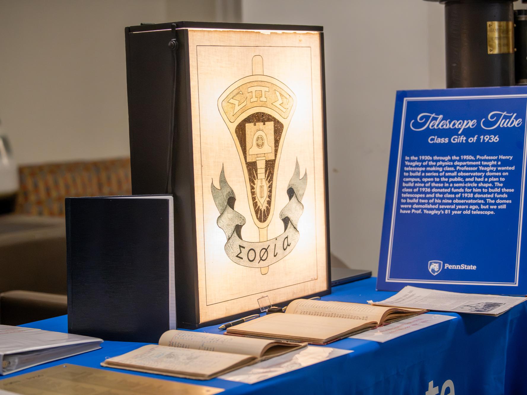 A display of artifacts from Marsh White at the Physics Ph.D. celebration event.