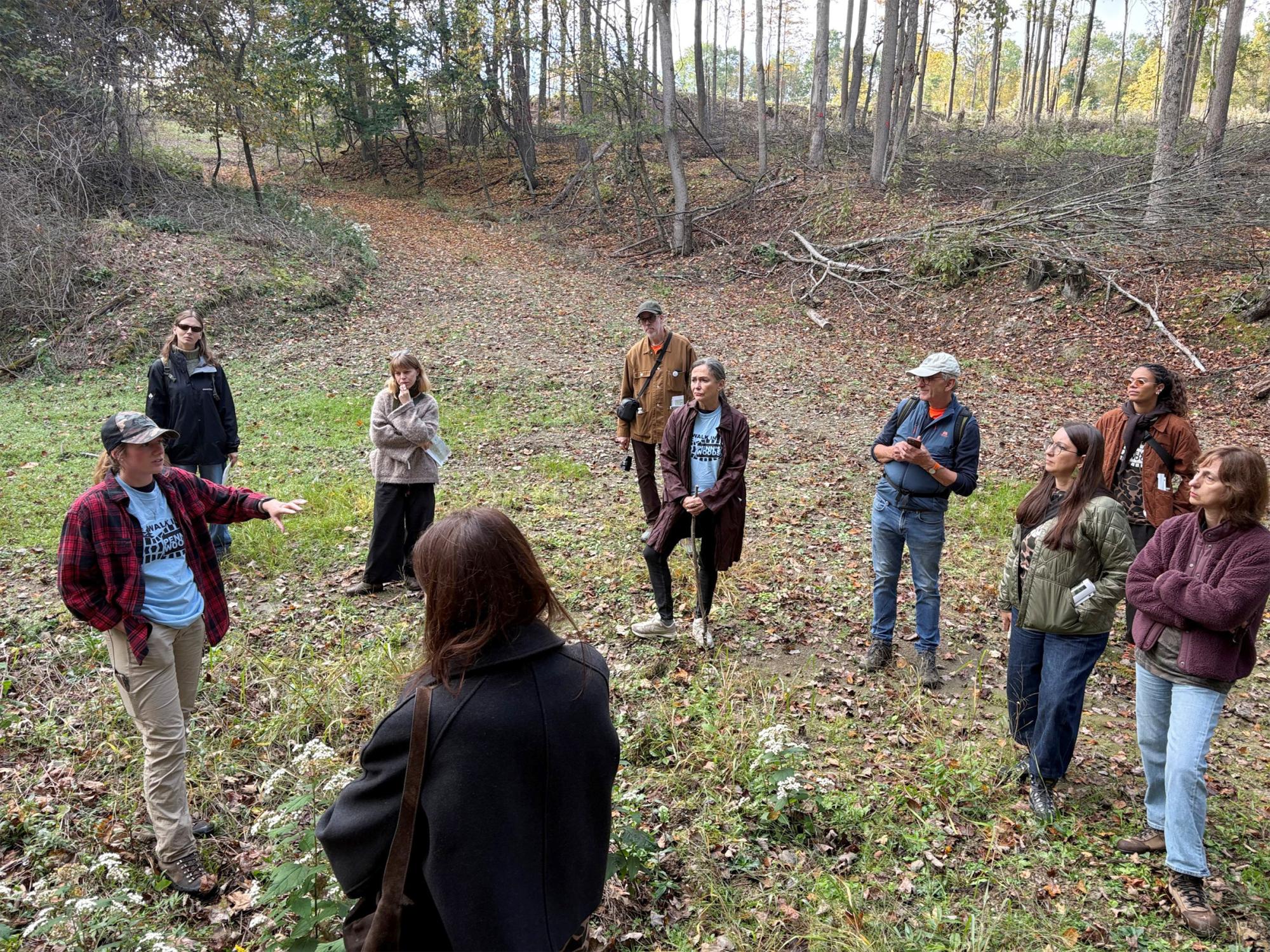 Penn State alumna Elizabeth Bruner shares her knowledge during a hike at the Community Woodlands at Treasure Lake, in Clearfield County. The hike was attended by a group of international journalists visiting Pennsylvania.