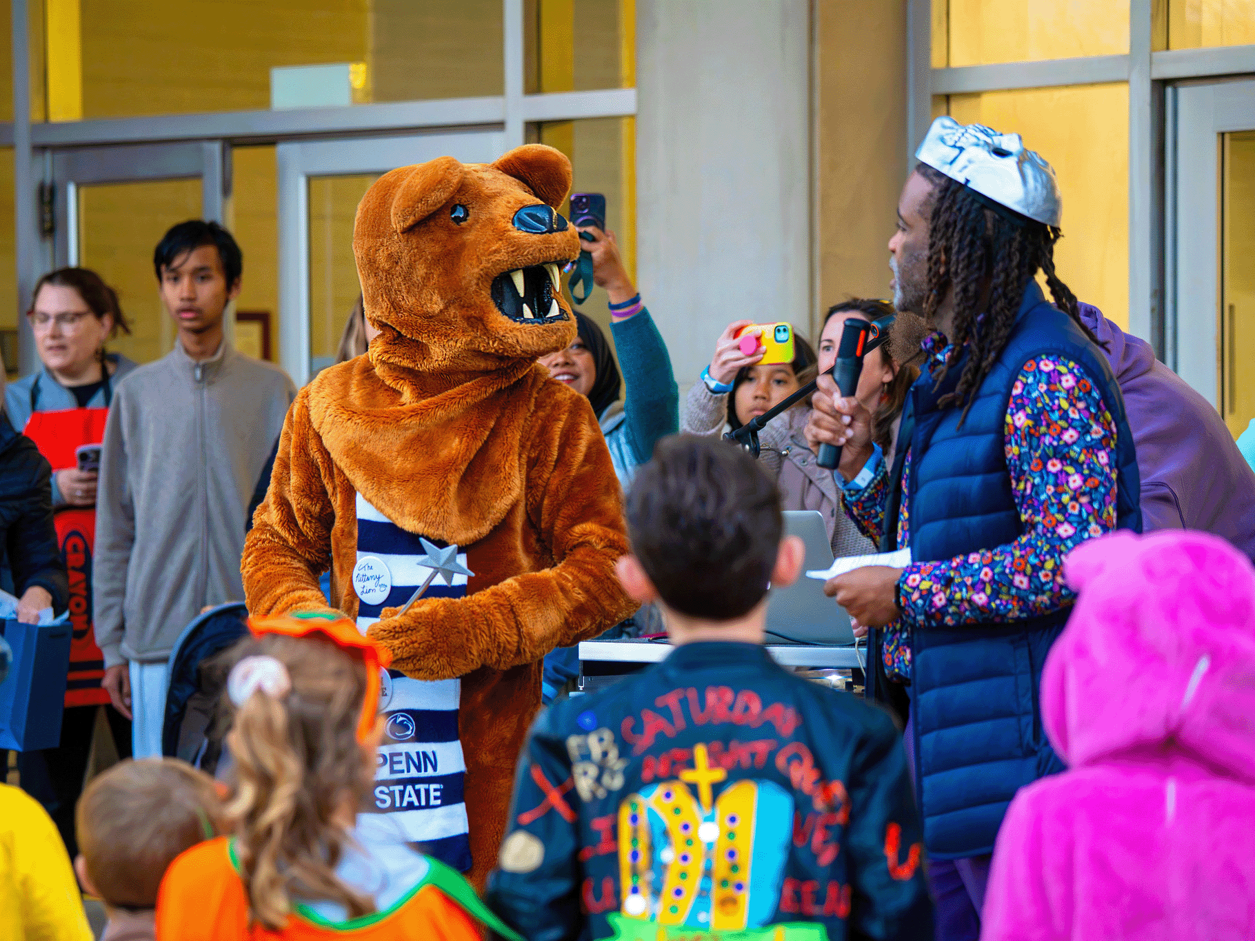 Levon T. Esters, vice provost for graduate education and dean of the Fox Graduate School, hosts the Halloween costume contest alongside a very special guest: The Nittany Lion mascot!