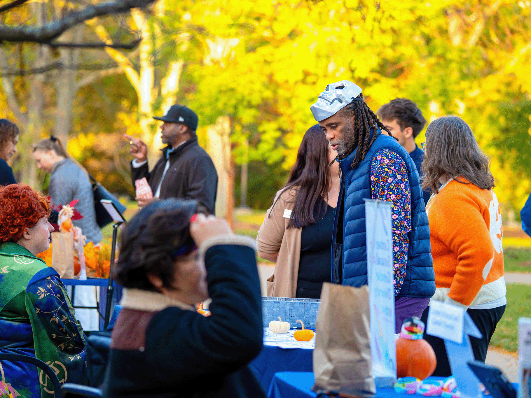 Dean Esters walks through the event and chats with the partner organizations hosting a table.