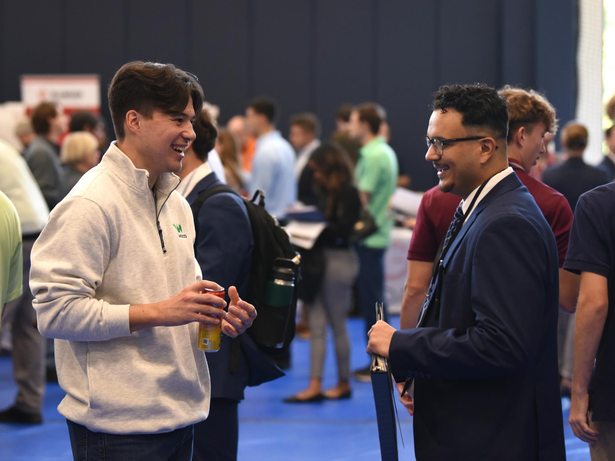 A student talks with a recruiter at Penn State Behrend's fall Career and Internship Fair.