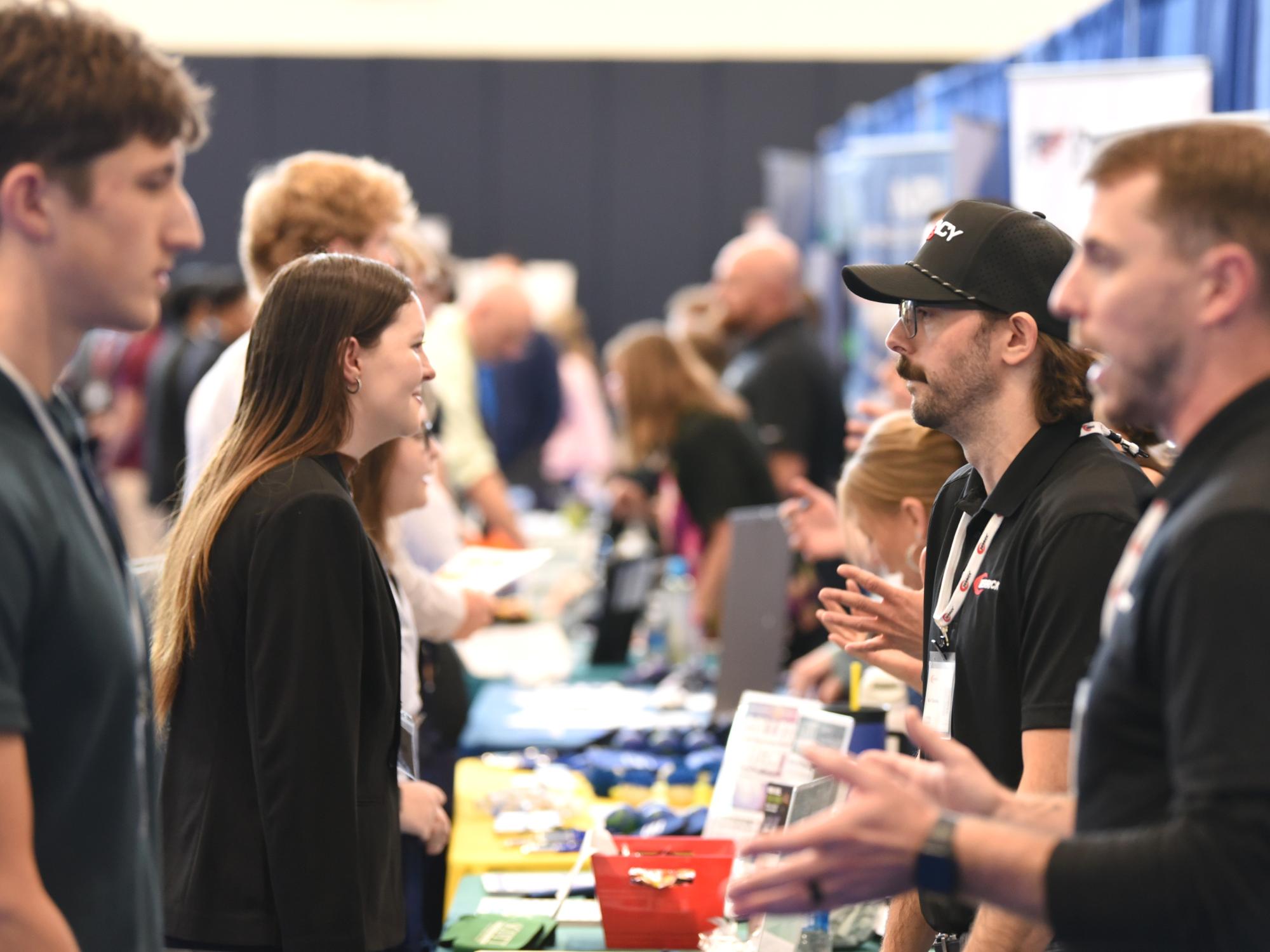 Students talk with corporate recruiters at Penn State Behrend's fall Career and Internship Fair.