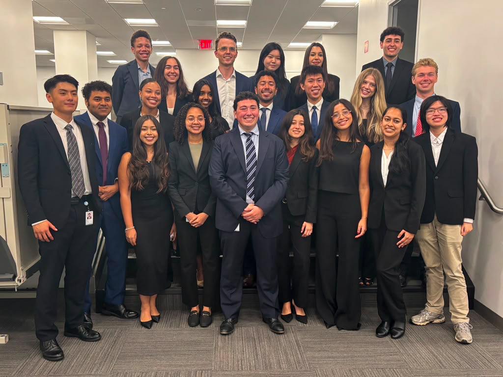 Daniel Garcia Calao in middle row, fourth from right, wears a navy suit and tie, at the World Bank Treasury. 