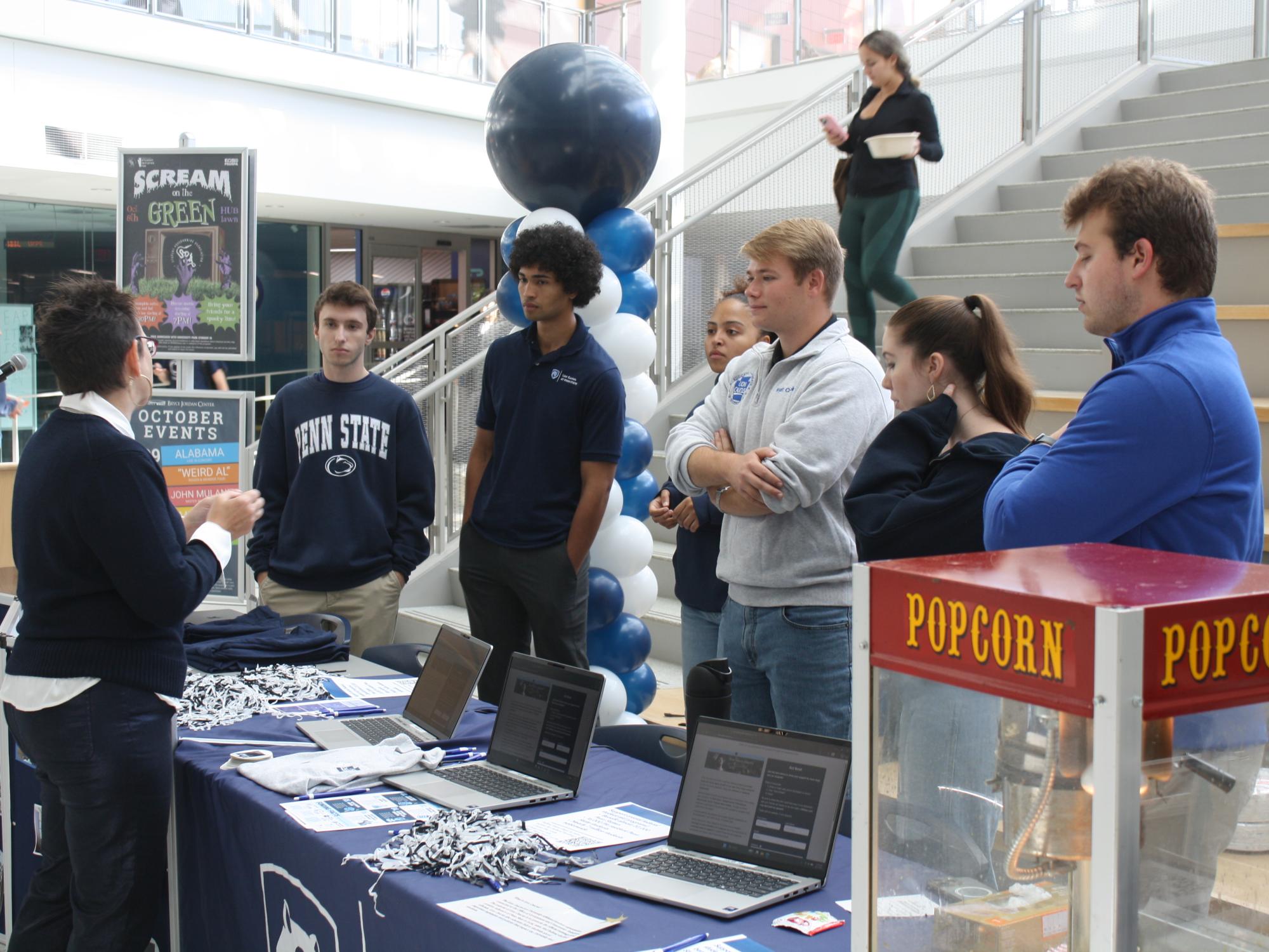 Students talking with alumni at an event at Penn State University Park