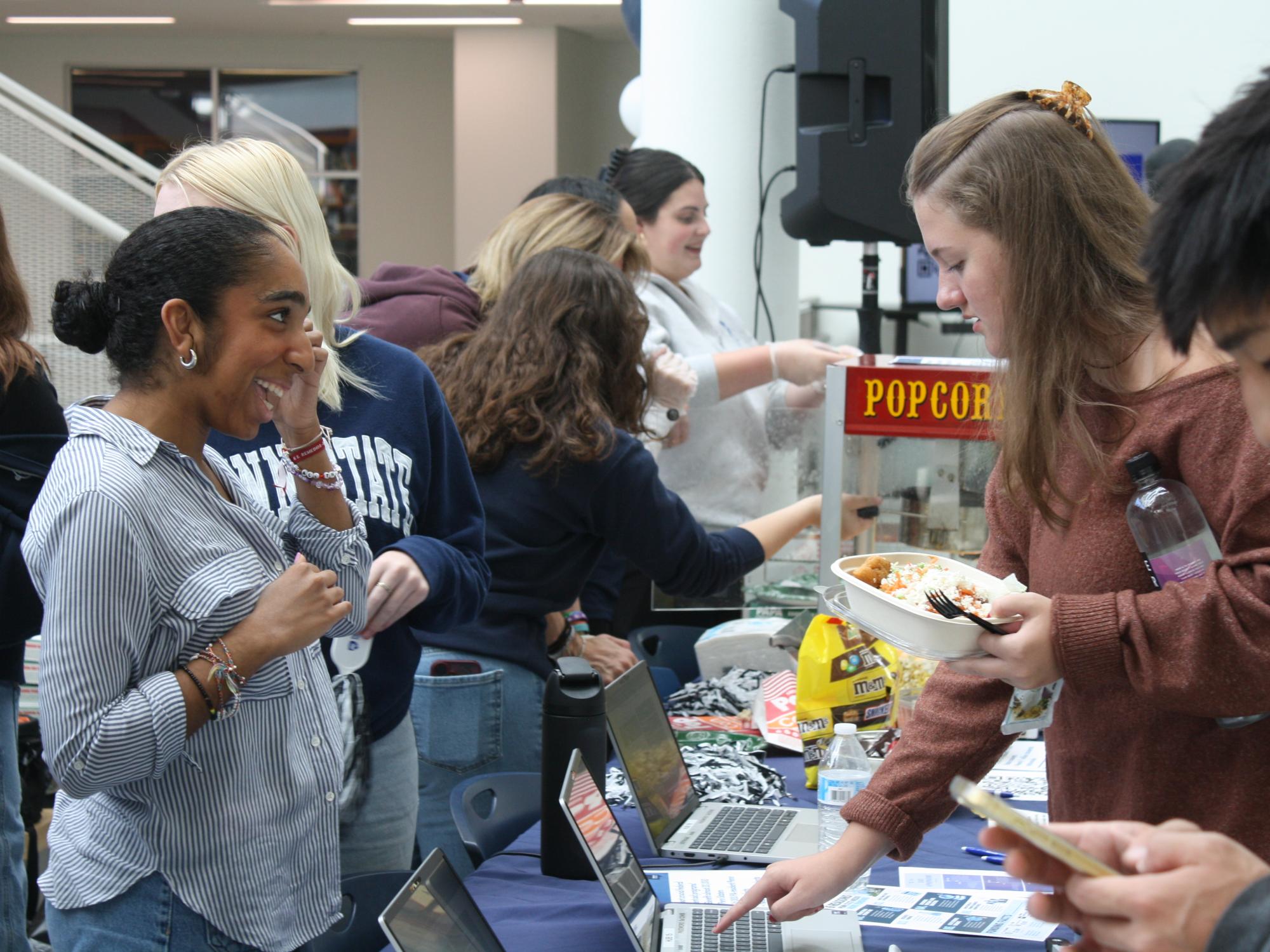Students talking together at an event at Penn State University Park
