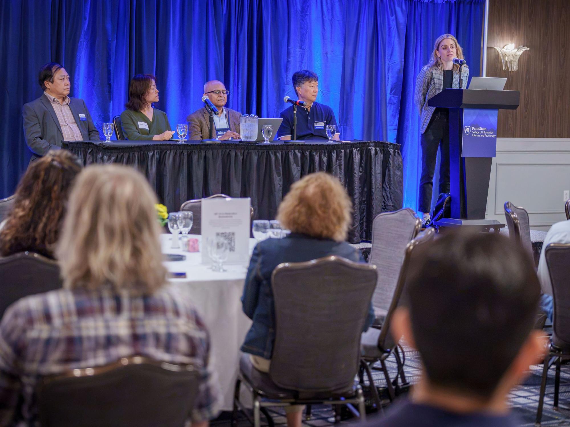 four faculty members seated for panel discussion