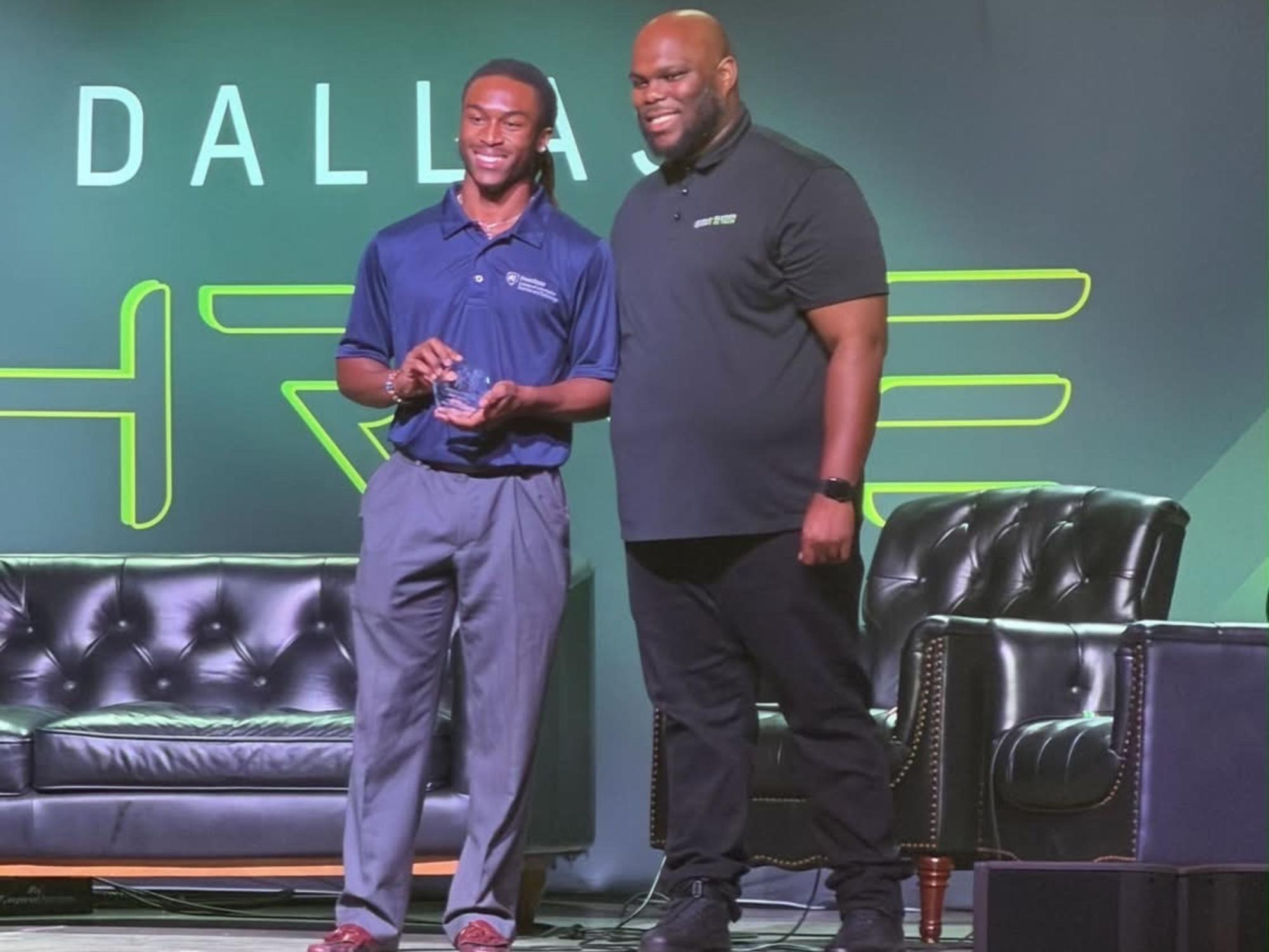 award recipient and presenter on stage