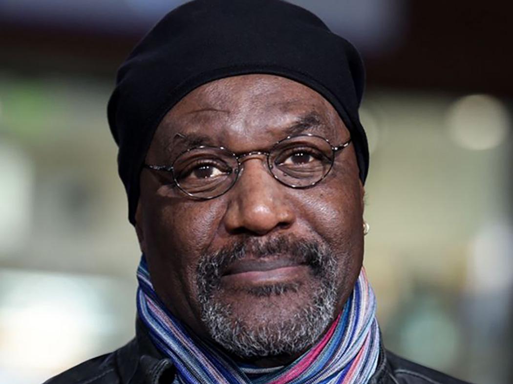 Smiling man wearing a scarf