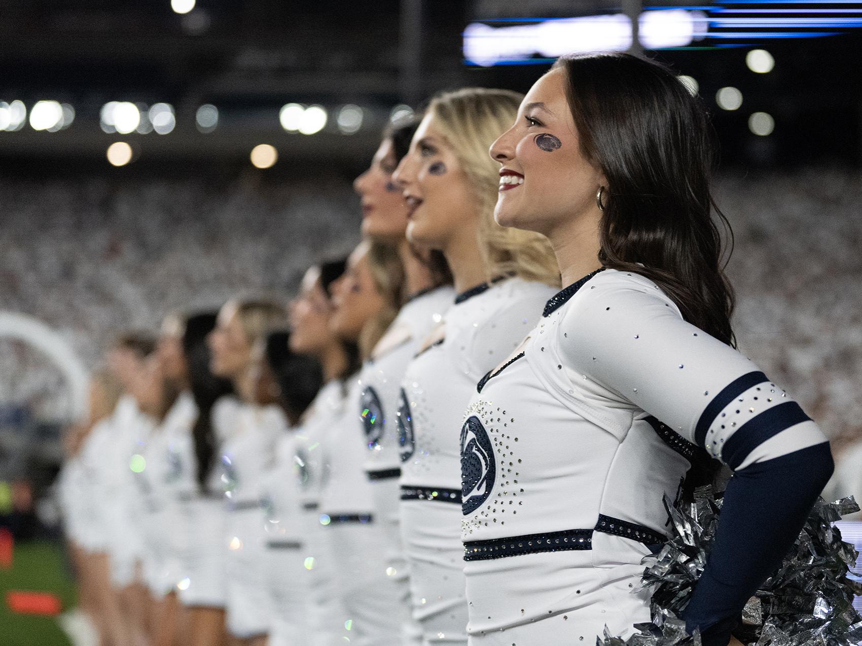 Dance team members stand in a line