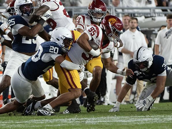 Defender tackles runner