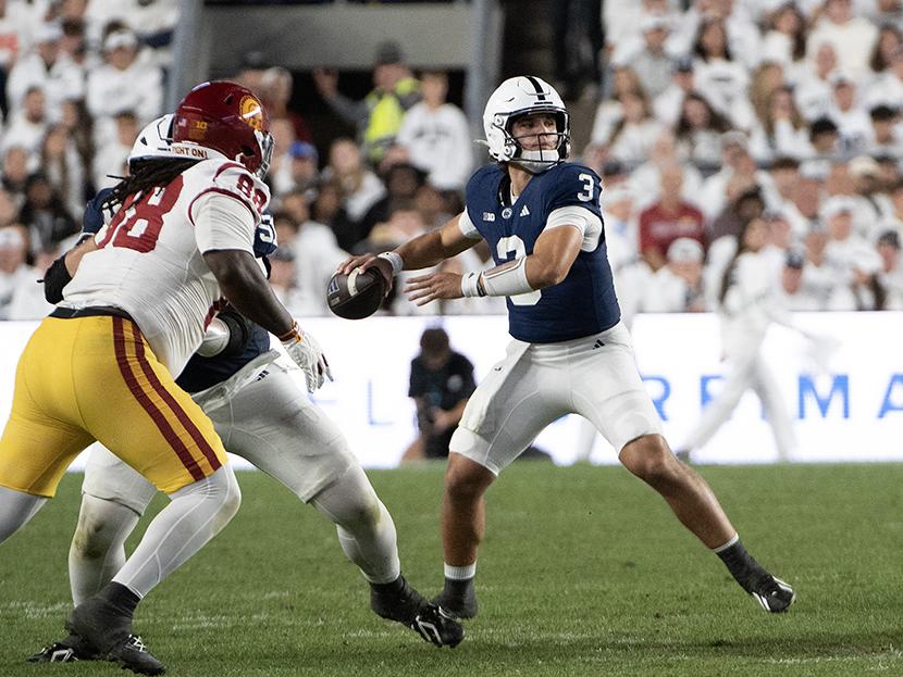 Quarterback throwing ball
