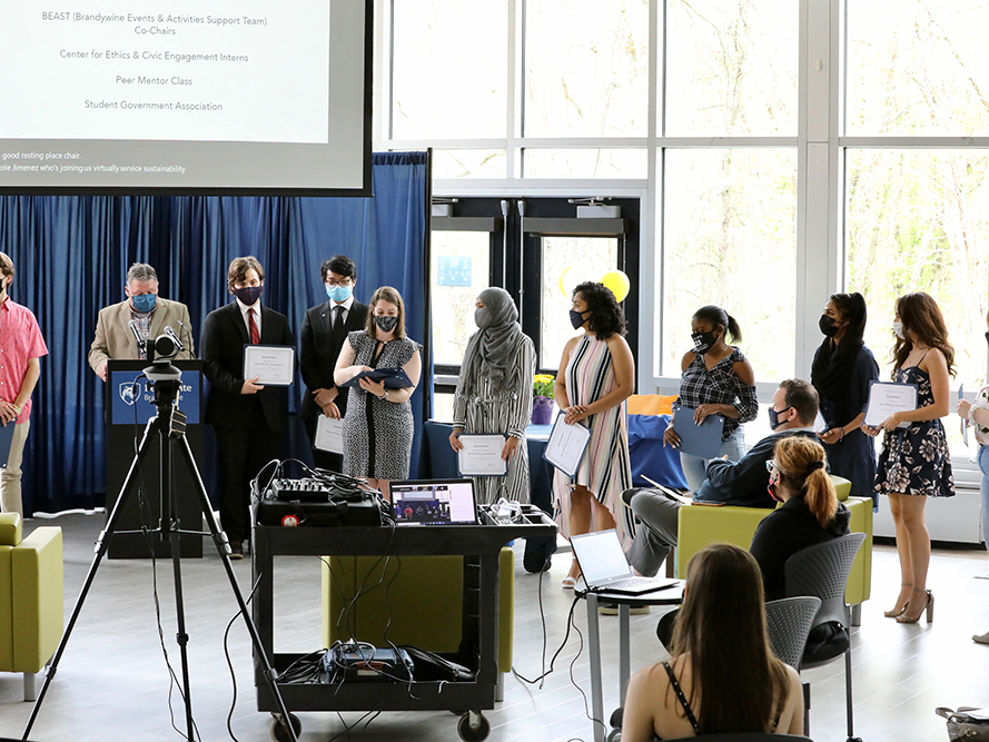 Students receiving their award certificates.