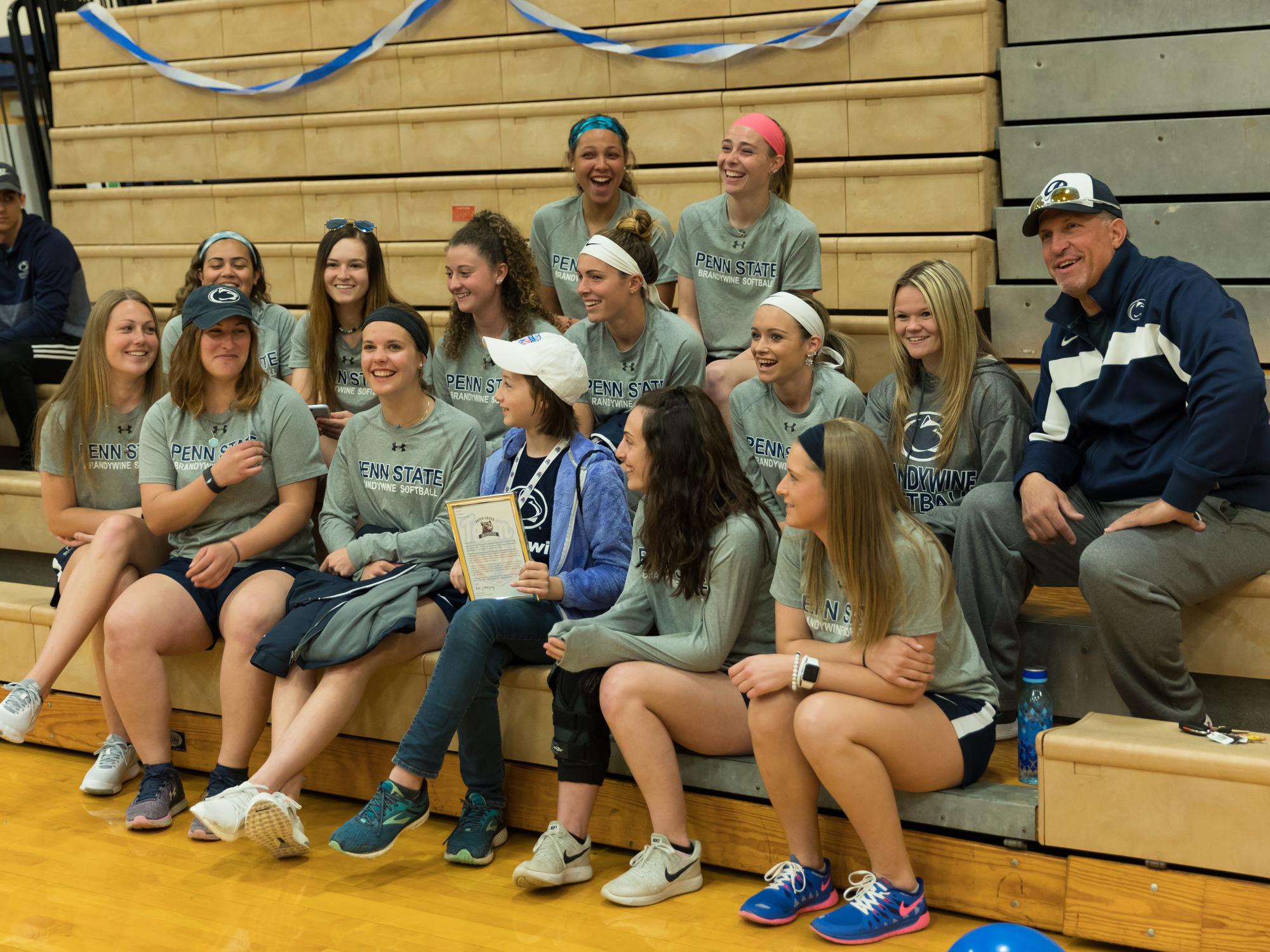 Ziah Oyler spends time with the Penn State Brandywine softball team