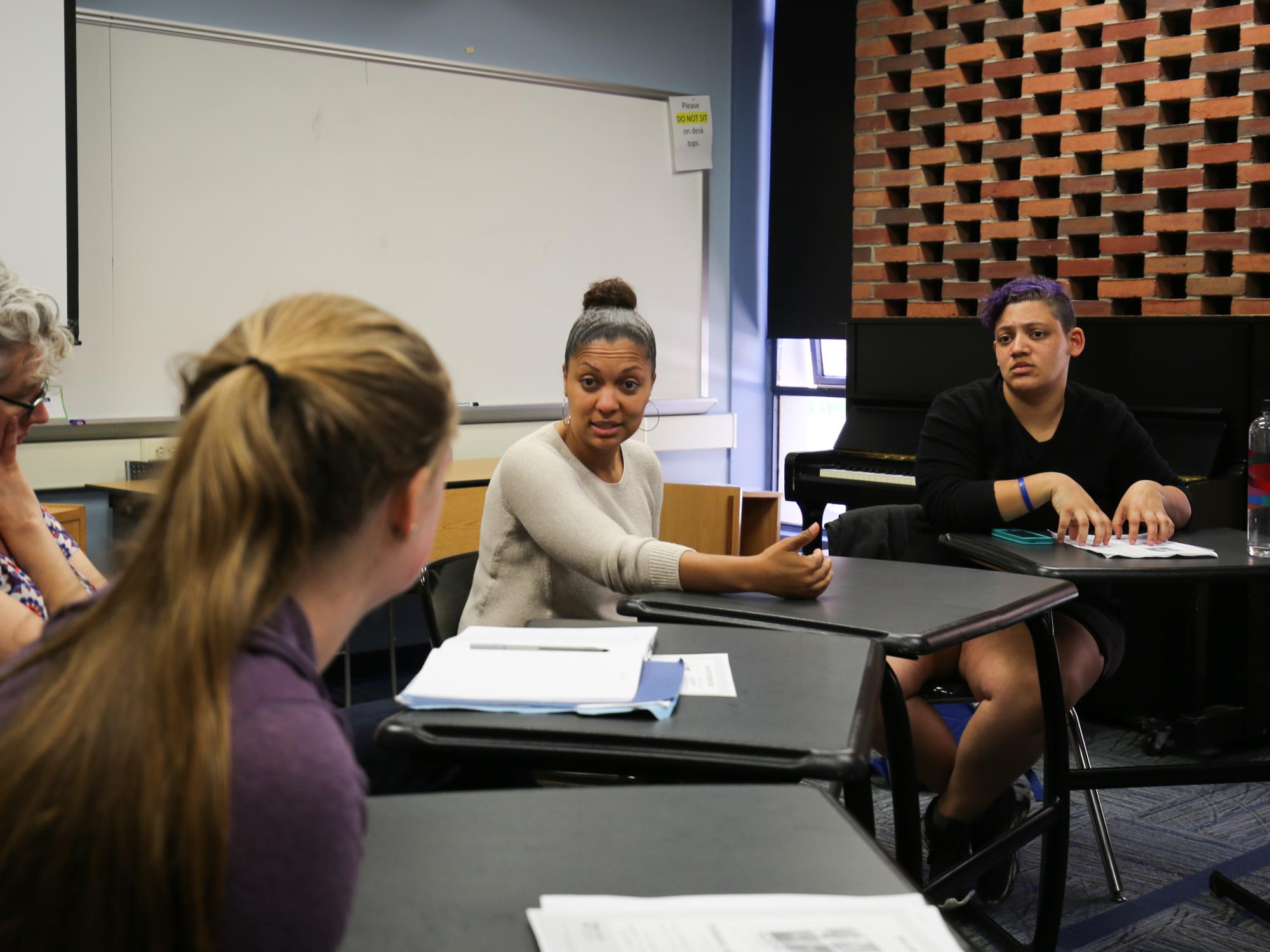 Kikora Franklin gives students suggestions about their performances. 