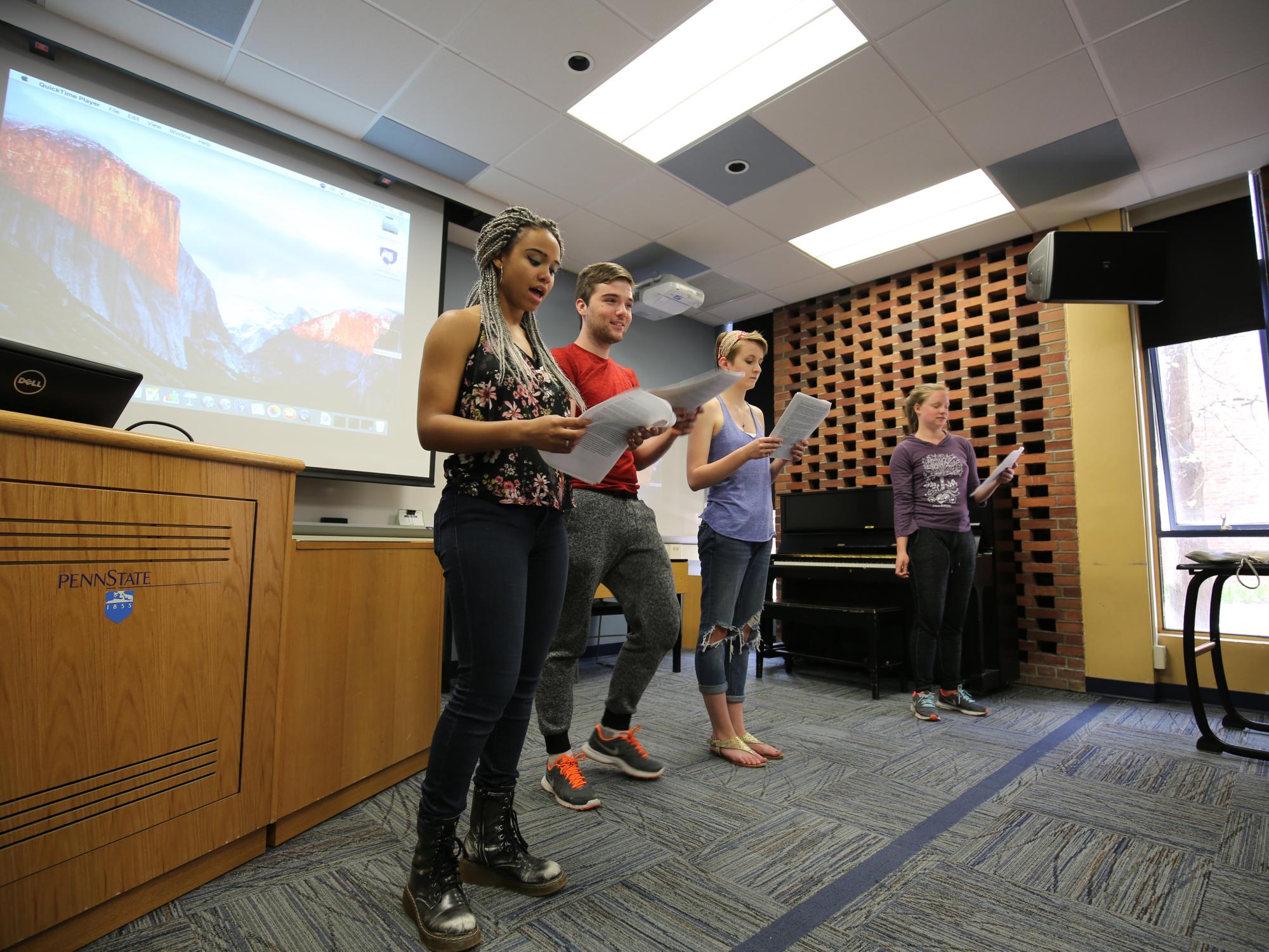 Students rehearse their lines for the performance. 