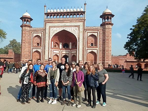 The group gathers at the entrance to the Taj Mahal.