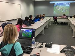 elementary school students playing video game in Larson transportation institute conference room