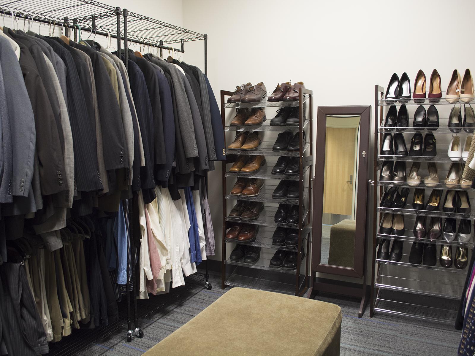 racks of clothing and shoes