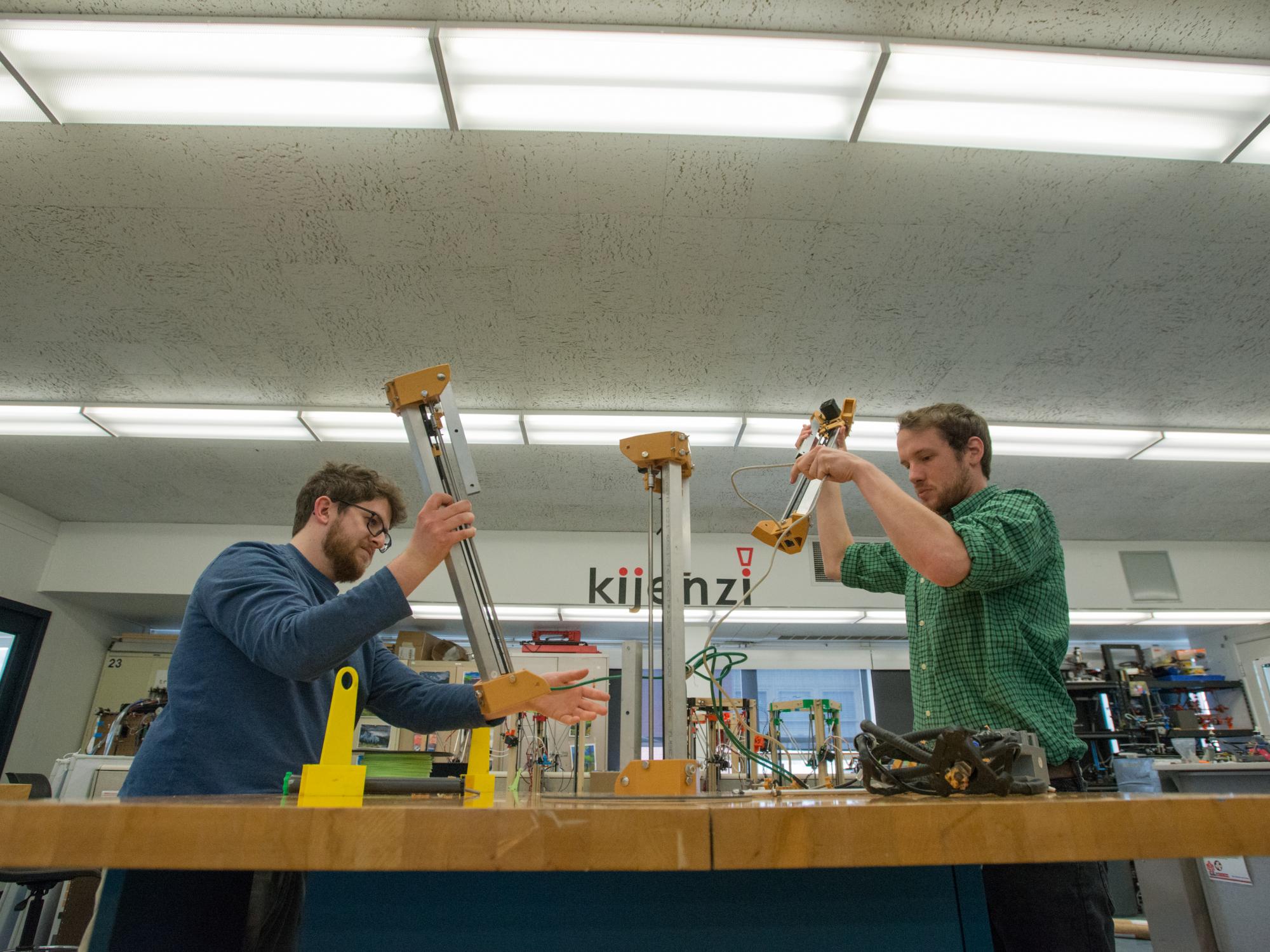 The Kijenzi printer is folded into a backpack. 