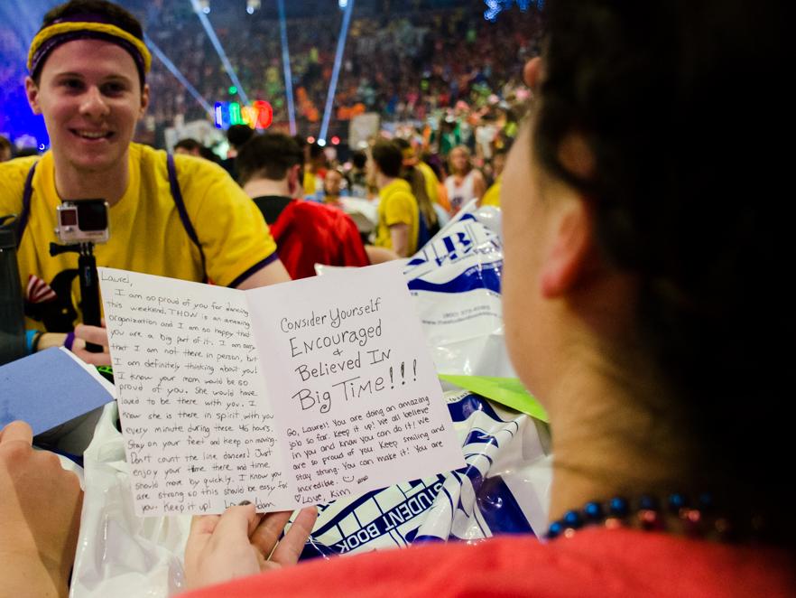 A student reading a card