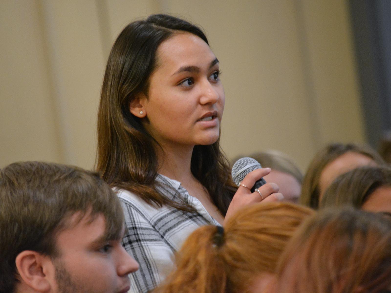 woman standing with microphone