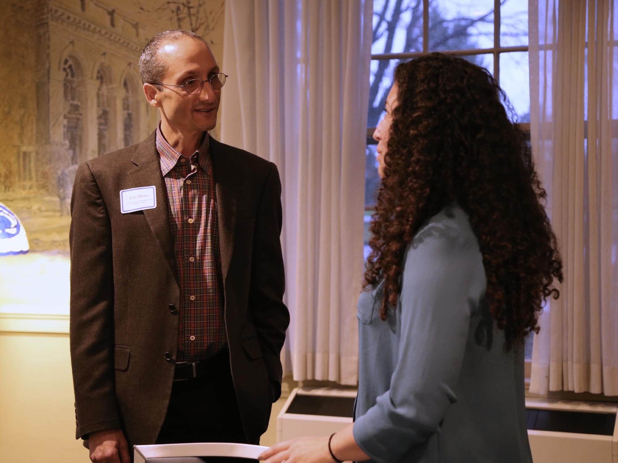 Associate Dean Eric Silver talks with Lauren Perrotti, fourth year doctoral student