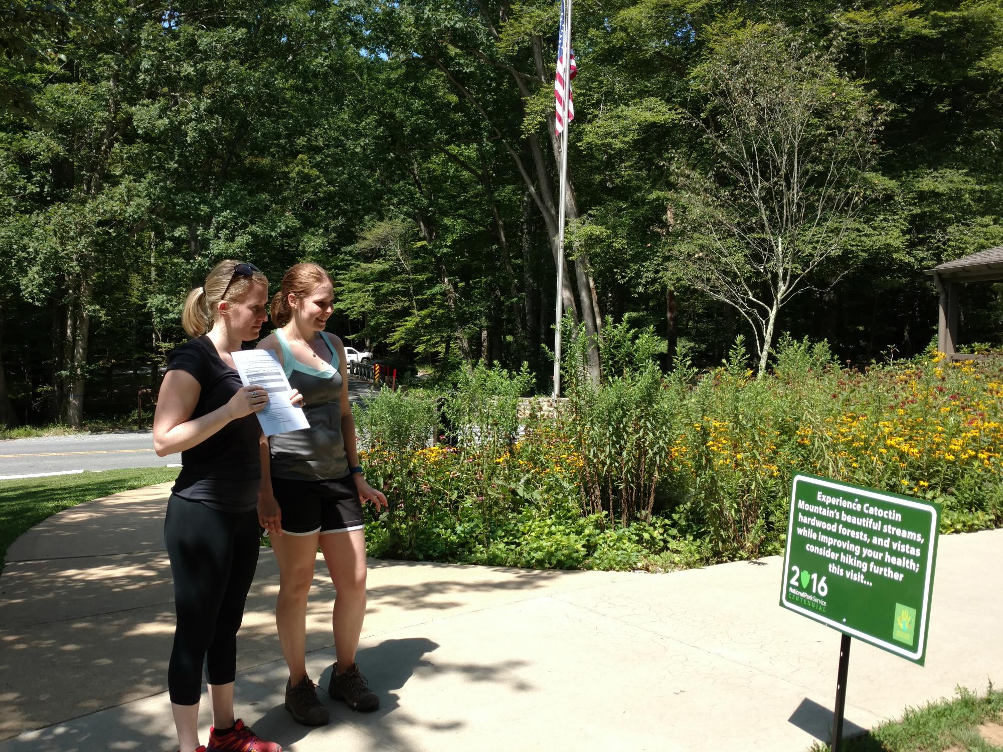 Park Visitors interact with sign