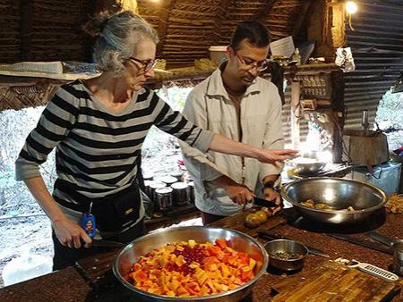Penn State Mont Alto faculty members Deborah Mirdamadi and Somjit Barat prepare a vegan meal at Sadhana Forest.