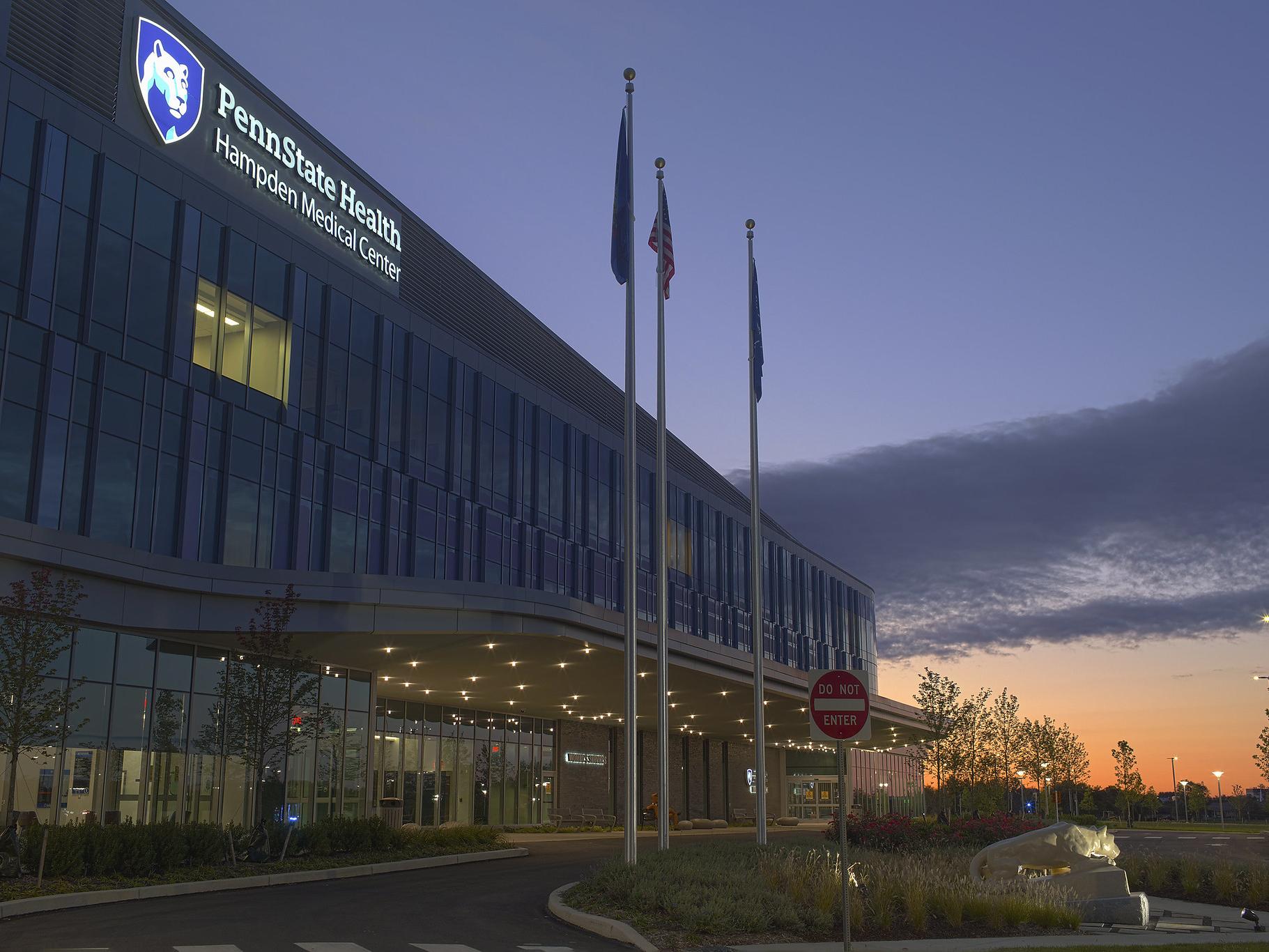 An external view of Hampden Medical Center, at dawn, as the sun rises out of frame.