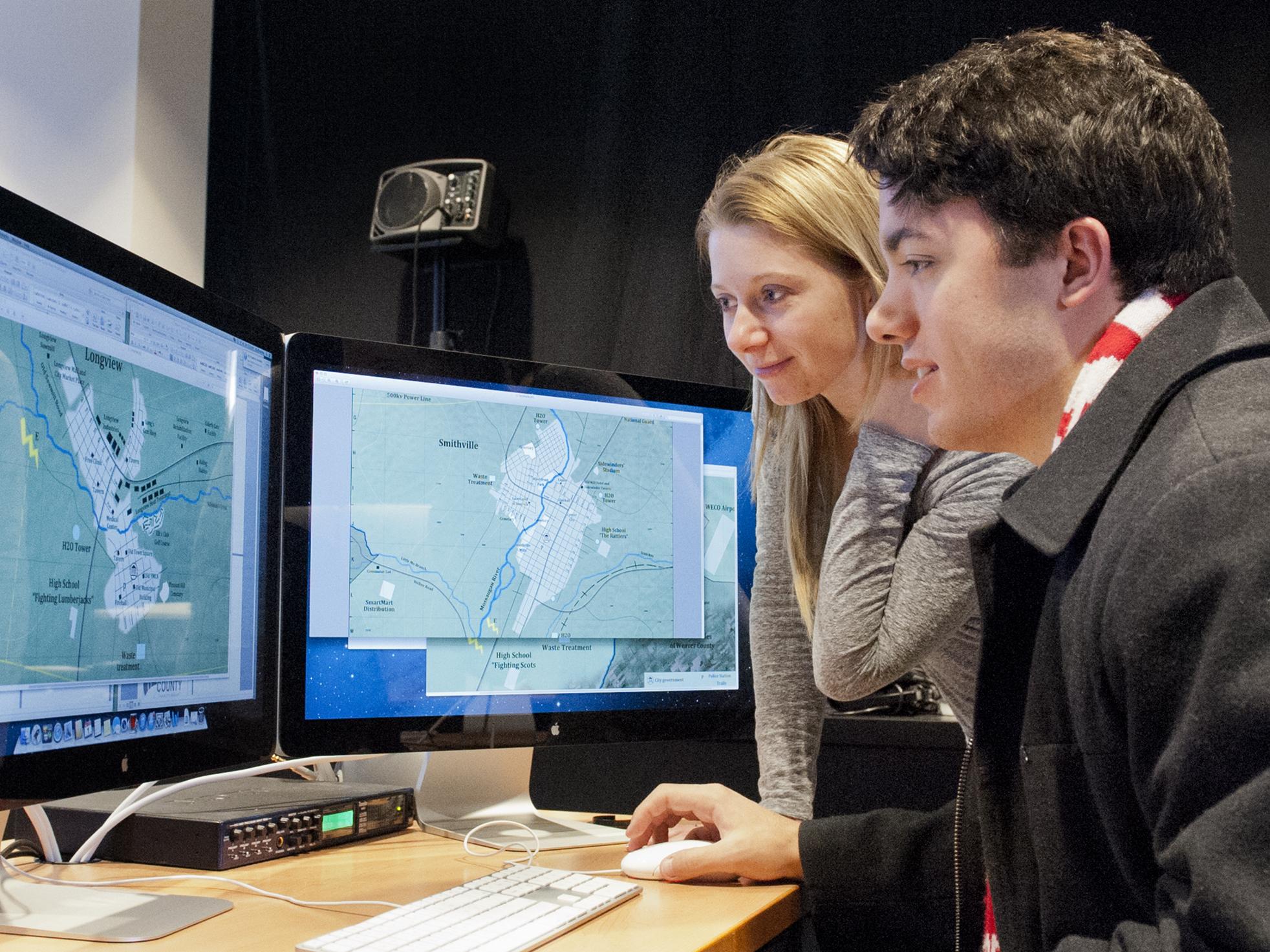 Jamie Shields, left, and Matt Lesniewski in the Red Cell Analytics Lab.  
