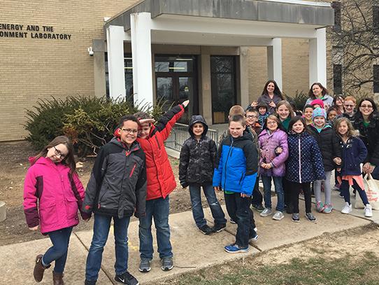 group photo of students standing outside the Energy and the Environment Laboratory