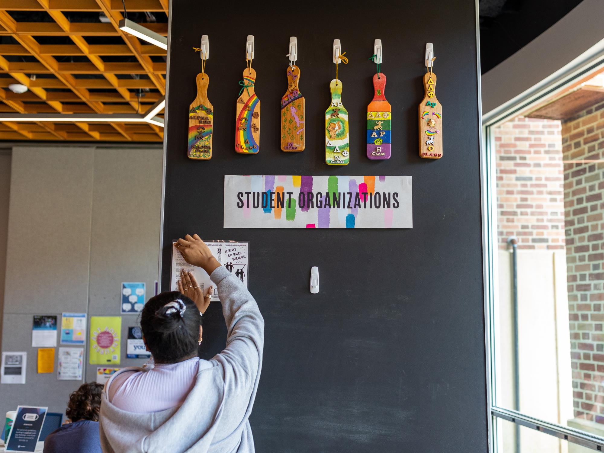 A student works on a wall display