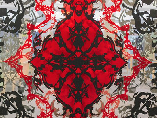 Red and black design on glass