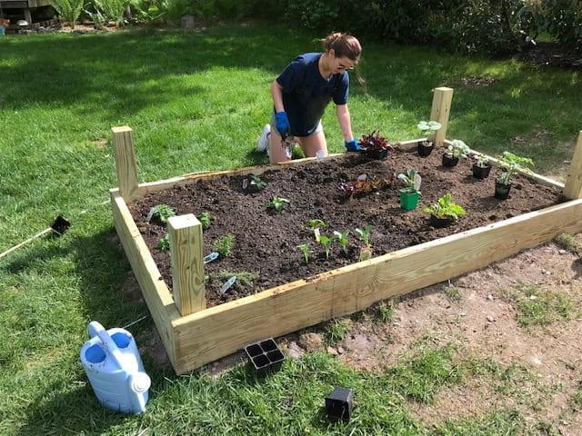 Woman in backyard garden