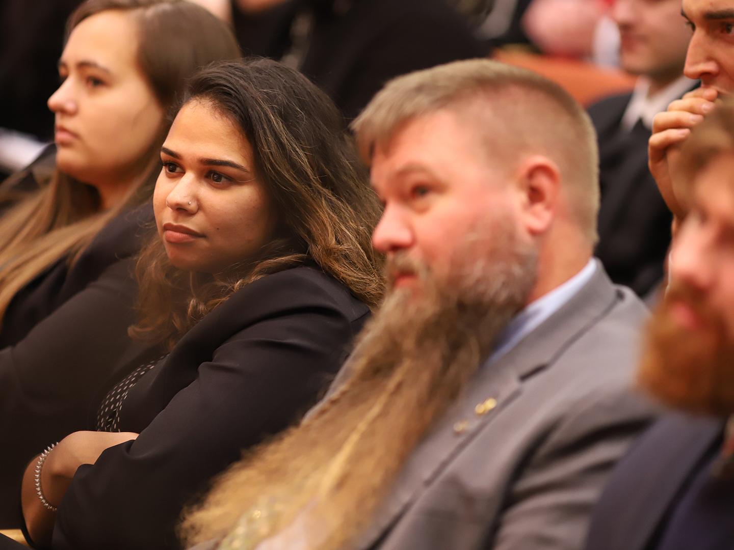 Audience members listen to Amb. Thomas