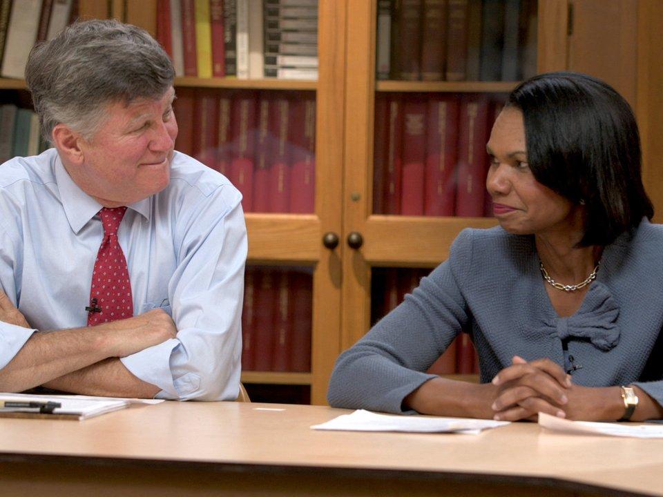 David M. Kennedy and Condeleeza Rice sitting in a library