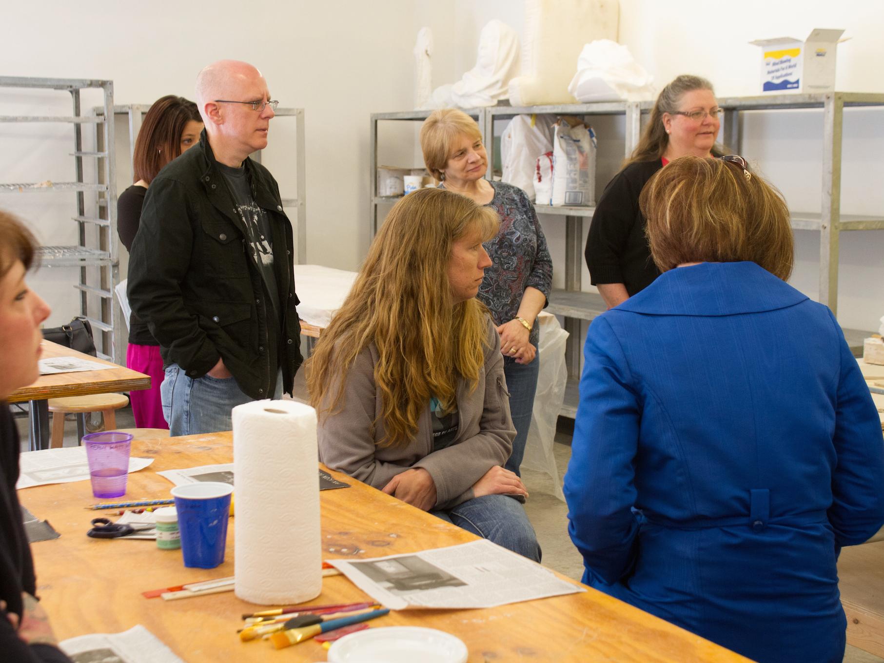 students listening to the ceramic surface decoration instructor