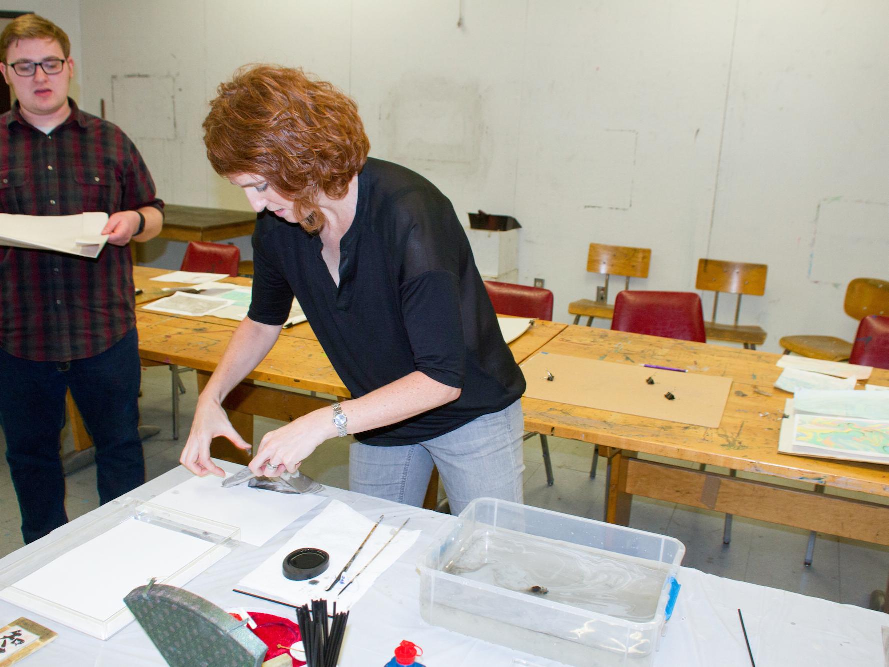 Participants paint at Suminagashi—The Ancient Japanese Art of Painting on Water 