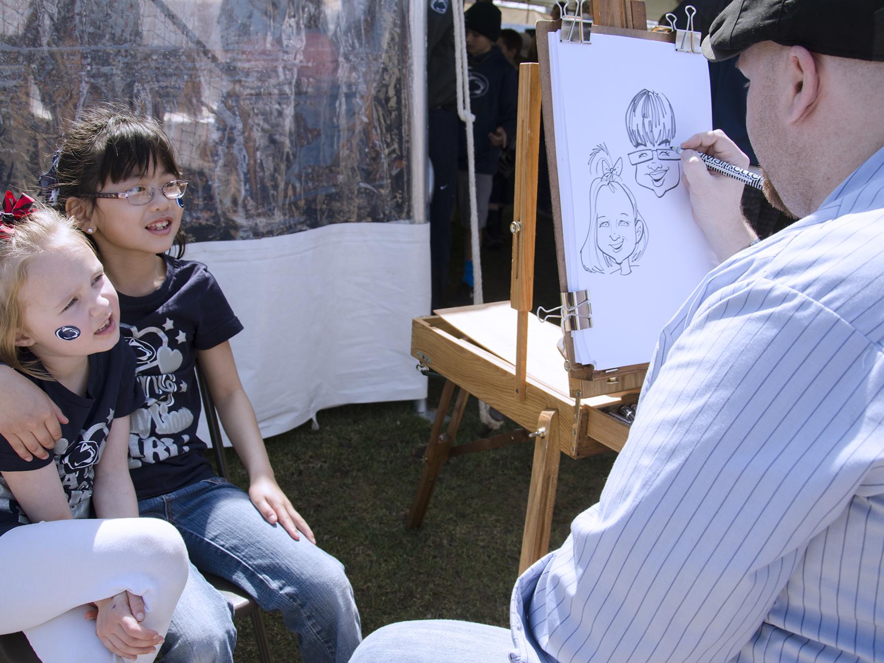 An artists draws two sisters