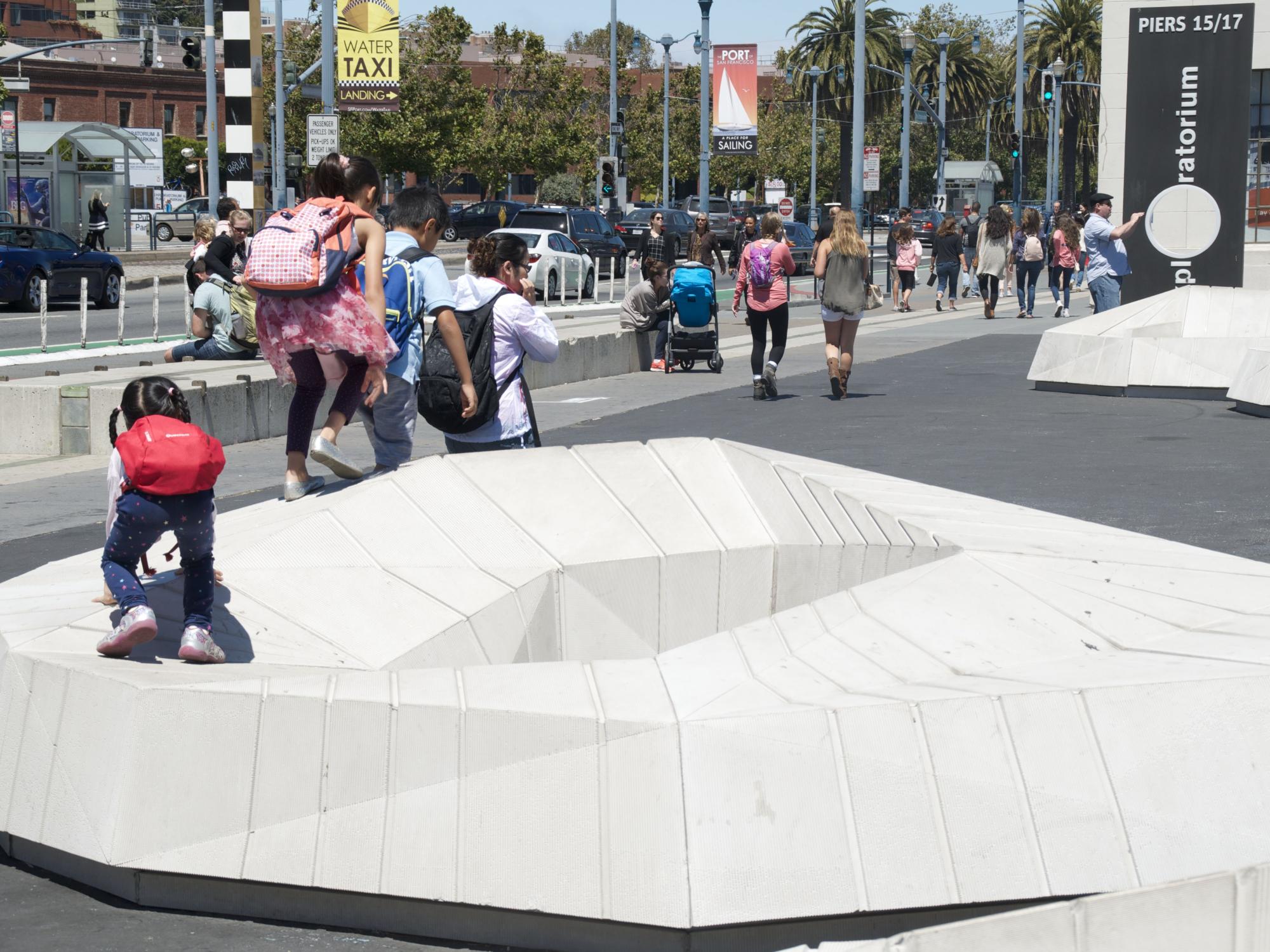A series of pre-cast concrete seating/play elements