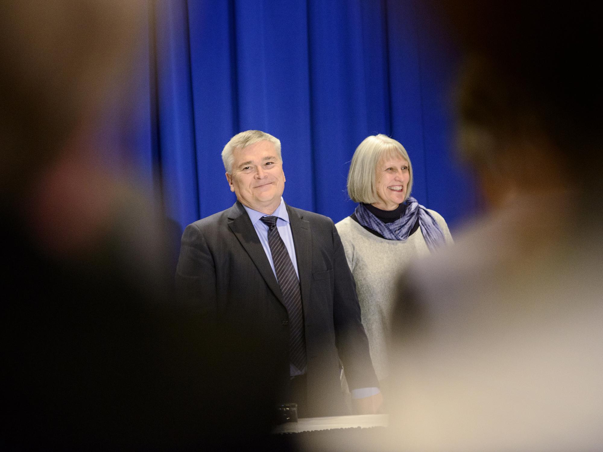 Eric and Molly Barron entering meeting