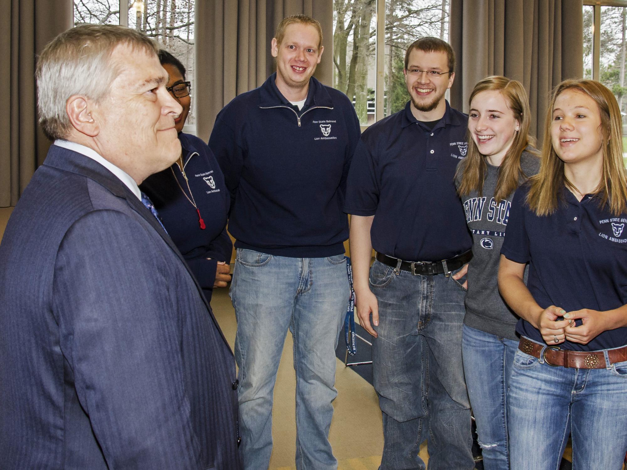 Penn State President Eric Barron talks to a group of students