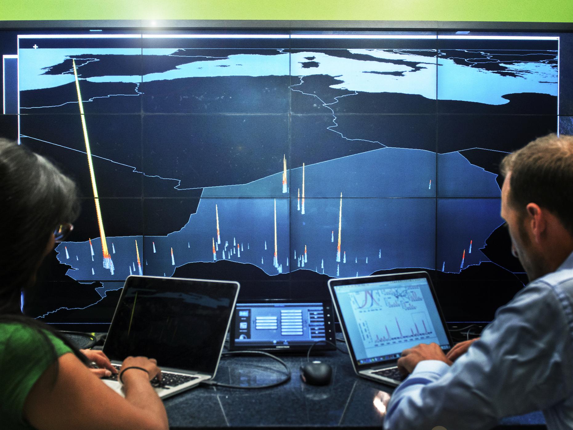 Nita Bharti and Matt Ferrari with satellite data