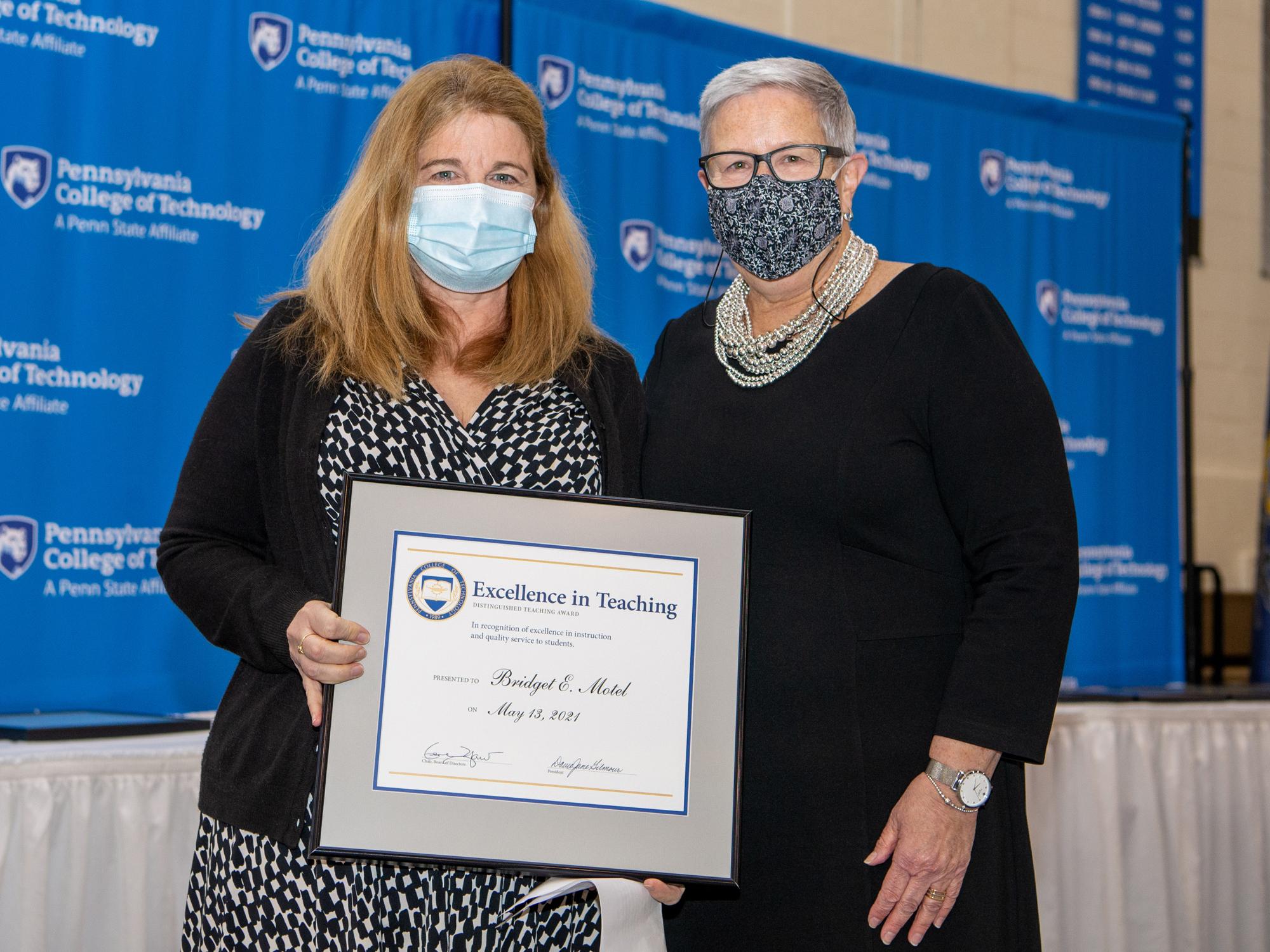 Bridget Motel, left, receiving an award from Davie jane Gilmour