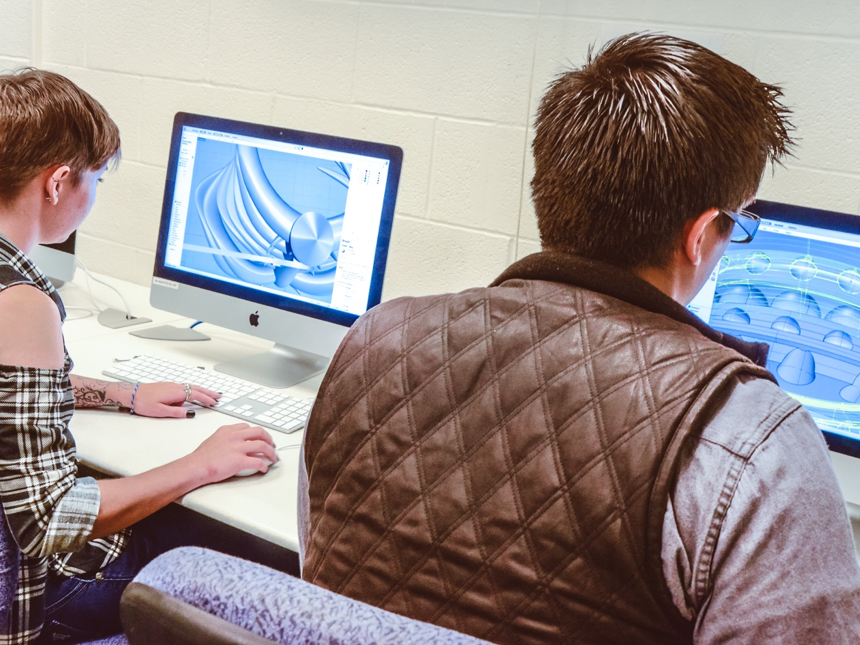 students design 3D models on computers