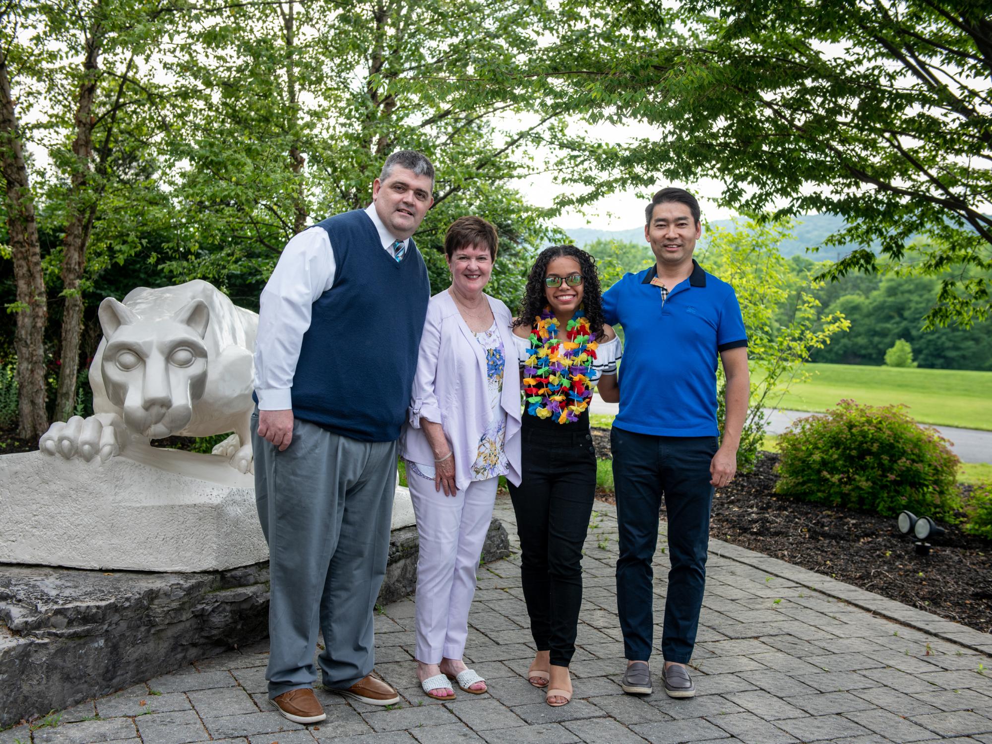 four people in front Nittany Lion