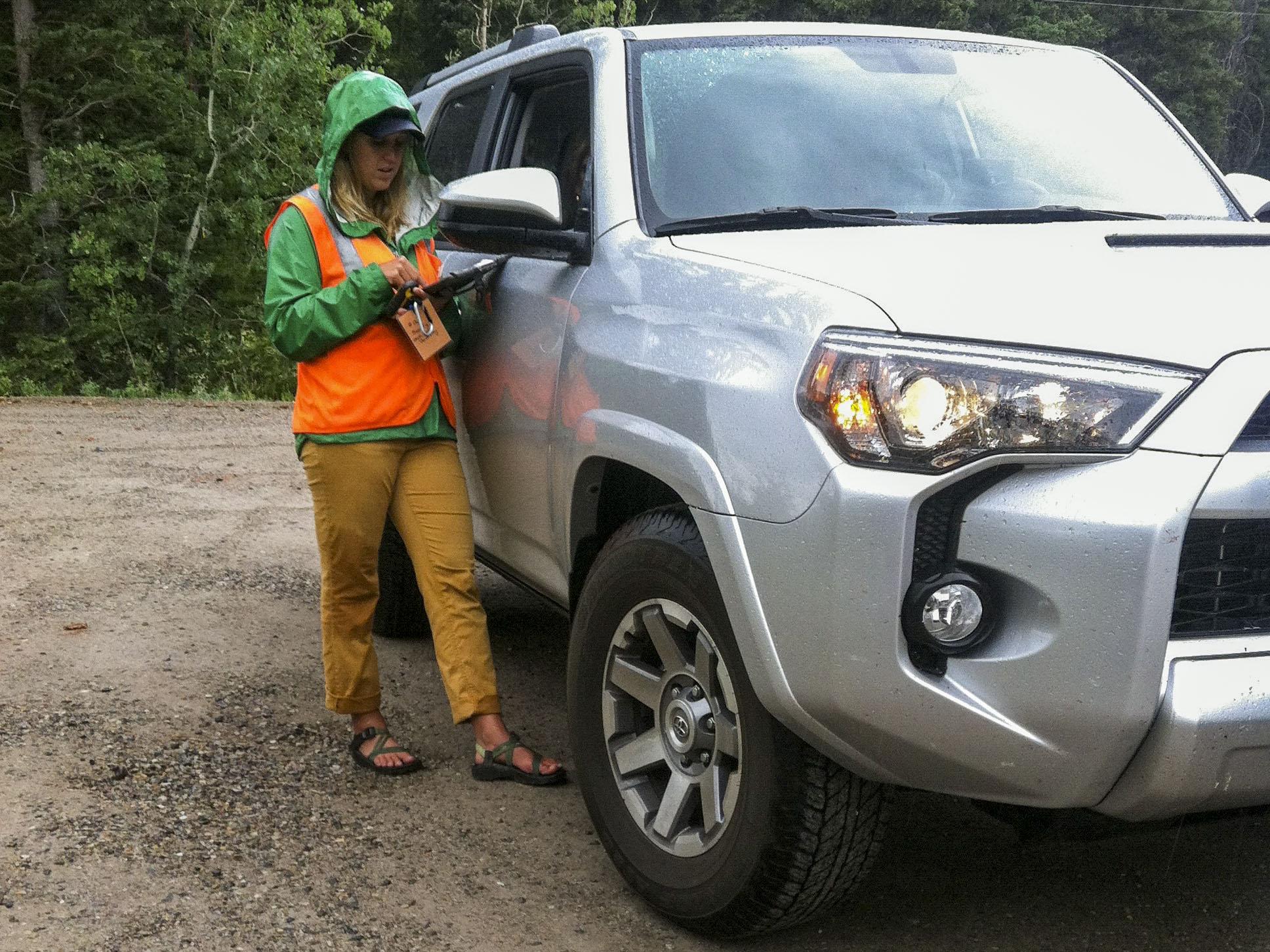 Lauren Abbott surveying a visitor in a car