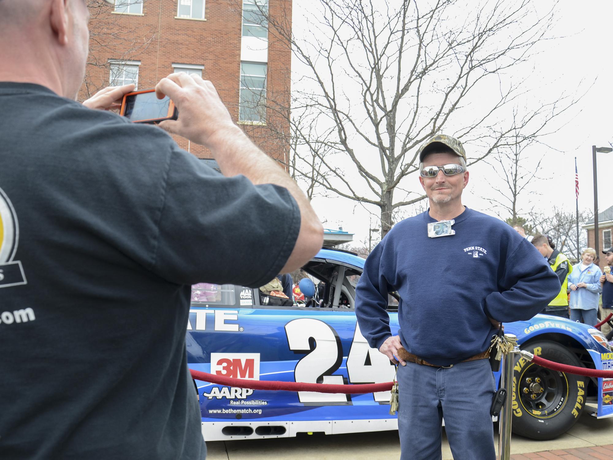 Mark Knepp stands by the race car