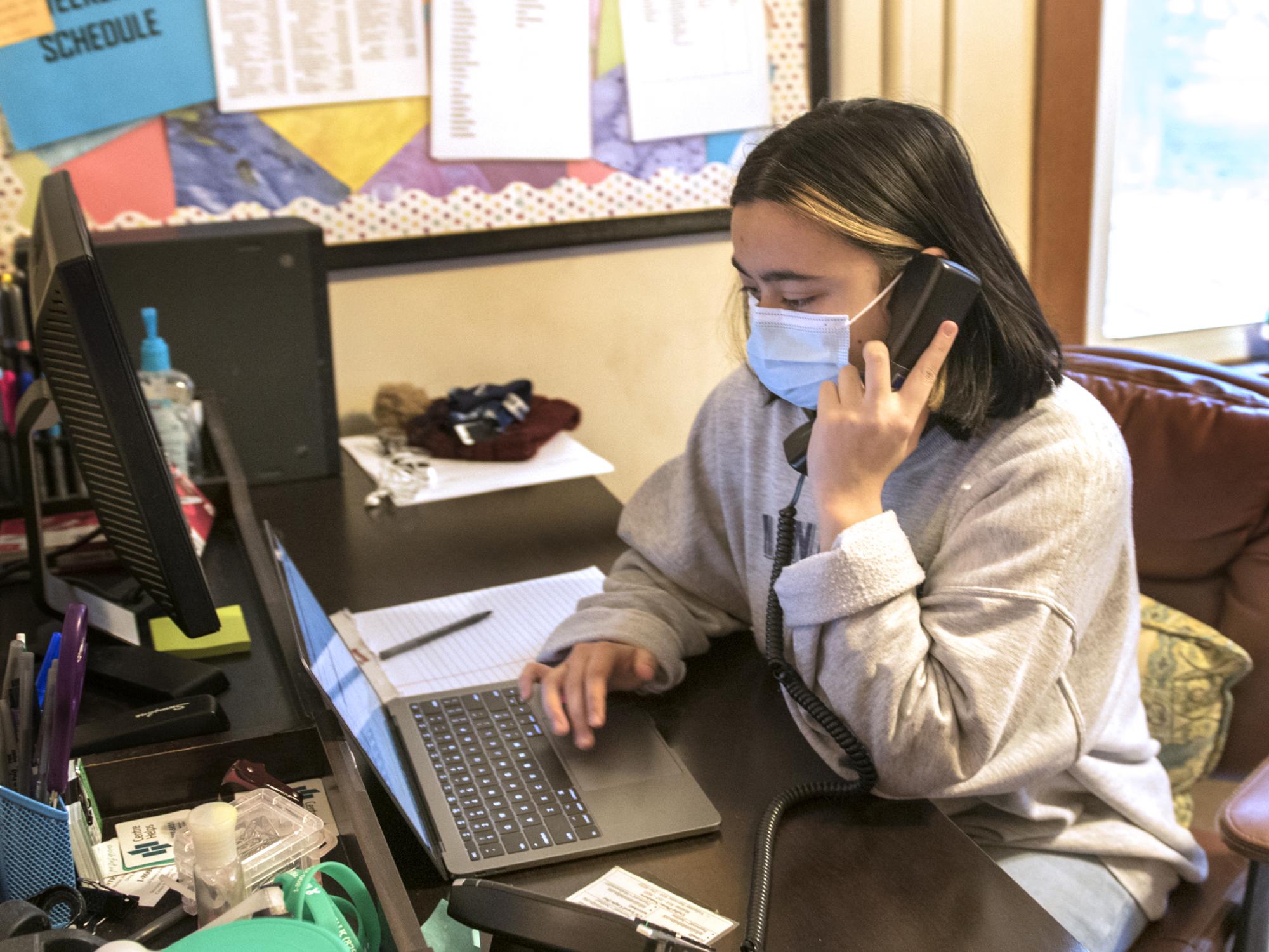 Centre Helps volunteer Theresa Hencinski helps answer calls to the Centre Helps hotline.