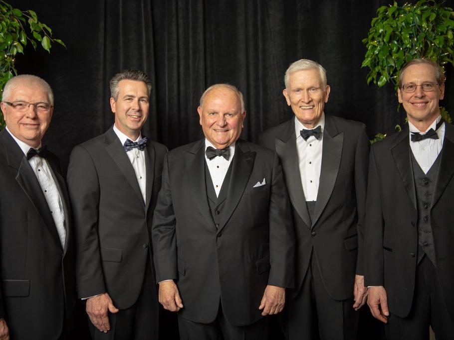 The past four Penn State Behrend leaders pose with Thomas B. Hagen, chairman of the board of Erie Insurance Group